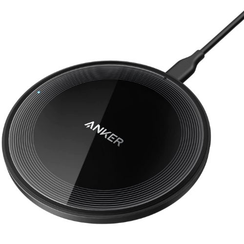 Anker wireless charging pad with flat circular design for charging compatible iPhones, Samsung Galaxy phones, earbuds, and other Qi wireless charging devices.